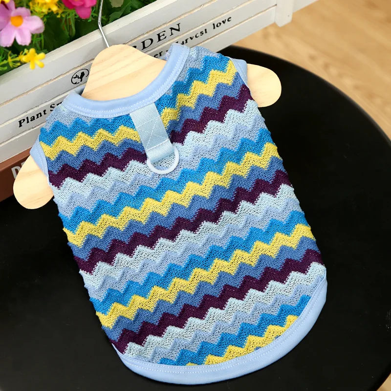 Blue chevron pet sweater with yellow and navy stripes on a blue background on a hanger