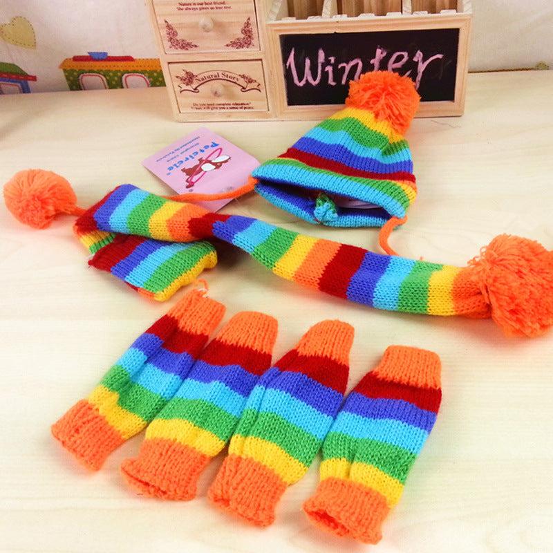 Colorful rainbow pet hat, scarf, and leg warmers set from Pet Panache Boutique for stylish, cozy pet accessories.
