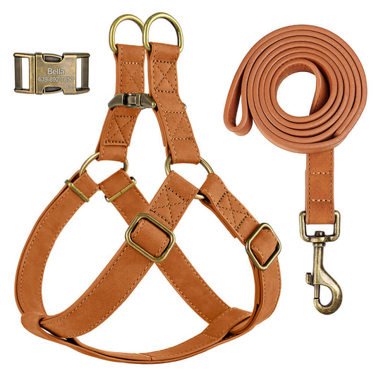 Honey brown leather pet harness and leash set by Pet Panache Boutique displayed on a textured surface.