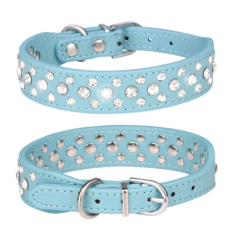 Blue leather pet collar with rhinestone accents from Pet Panache Boutique, featuring adjustable strap and decorative embellishments.