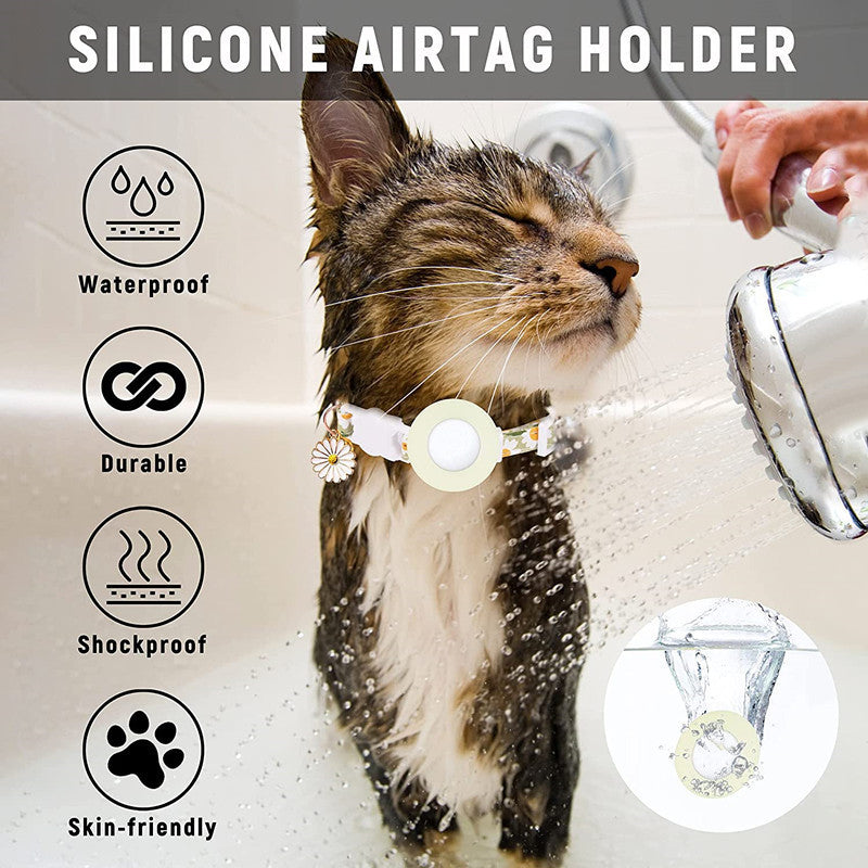 Pink Daisy Air Tag cat collar with waterproof, durable, shockproof silicone holder on a wet cat