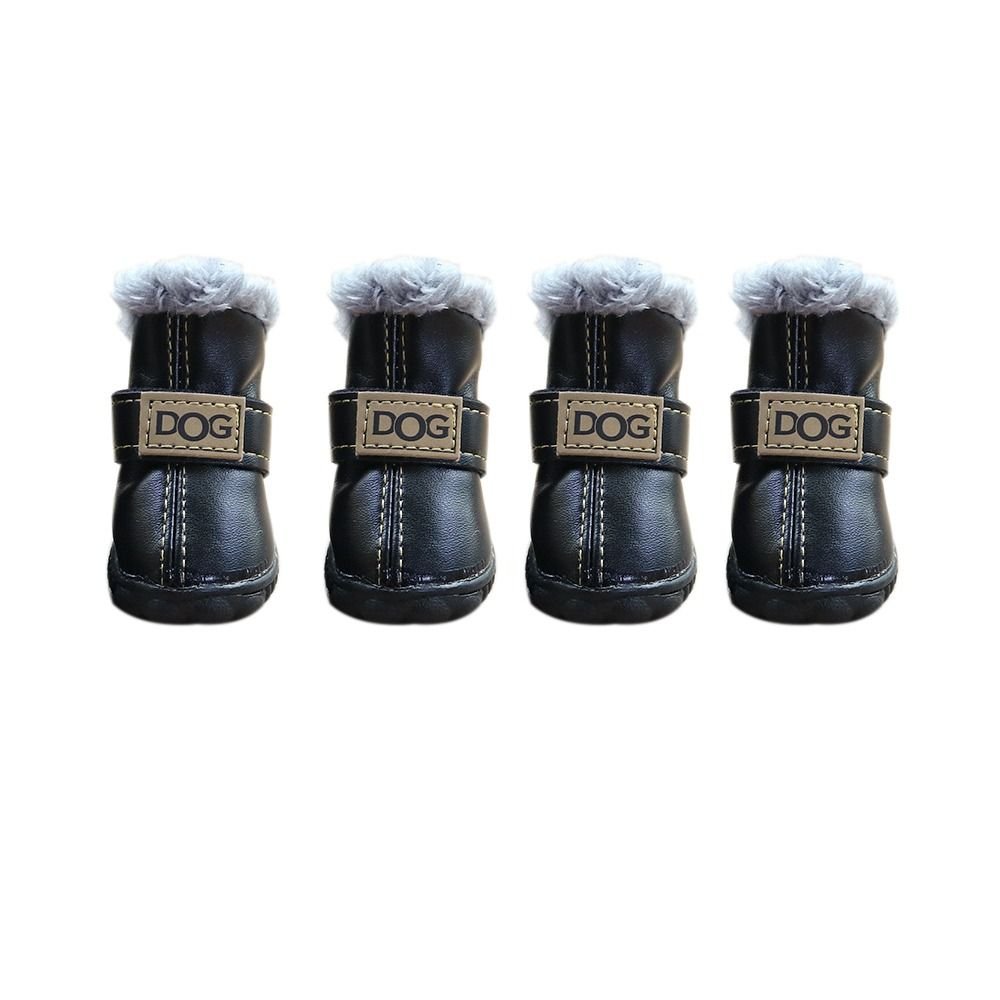 Black Pet Panache Boutique "DOG" pet boots shown on a dog, featuring durable black fabric and secure adjustable straps for outdoor protection.