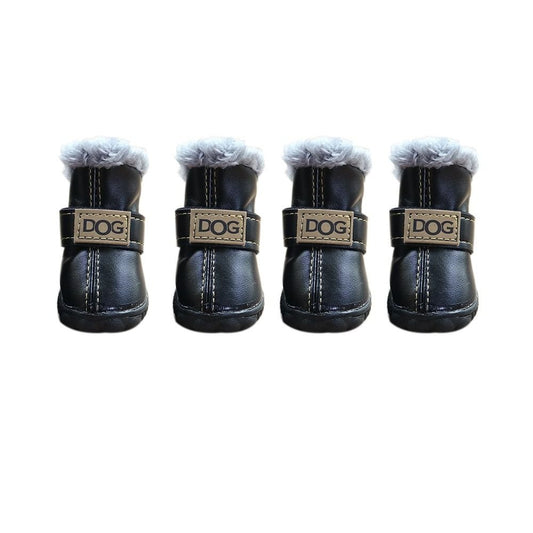 Black Pet Panache Boutique "DOG" pet boots shown on a dog, featuring durable black fabric and secure adjustable straps for outdoor protection.