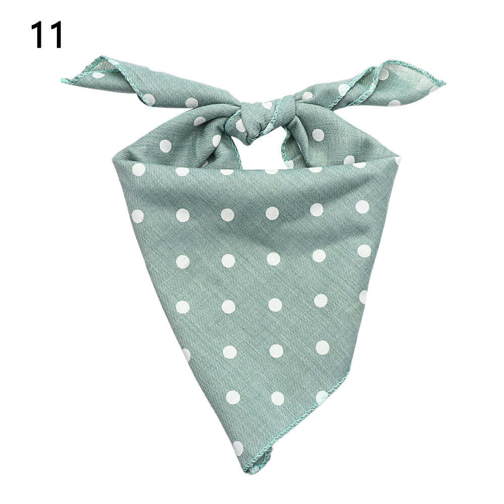 Blue Polka Dot Pet Bandanna in blue fabric with white polka dots, stylish pet wear made of quality materials.
