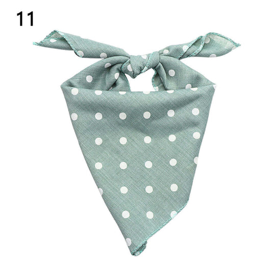 Blue Polka Dot Pet Bandanna in blue fabric with white polka dots, stylish pet wear made of quality materials.