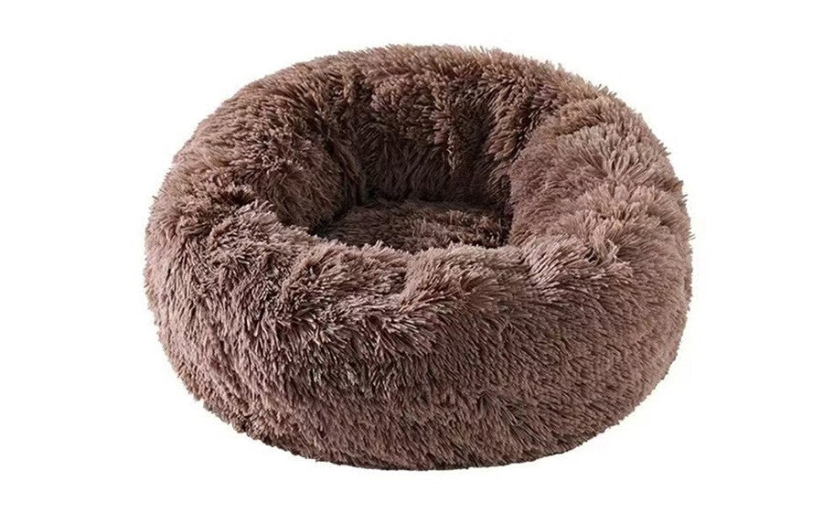 Brown plush round pet bed by Pet Panache Boutique, soft and cozy for small pets, with cushioned edges and plush fabric.
