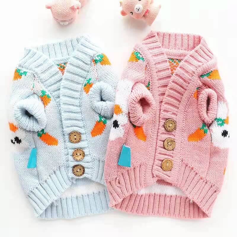 Easter Pet Sweaters in cheerful blue and pink with bunnies and carrots pattern, crafted from quality materials for stylish pet wear.