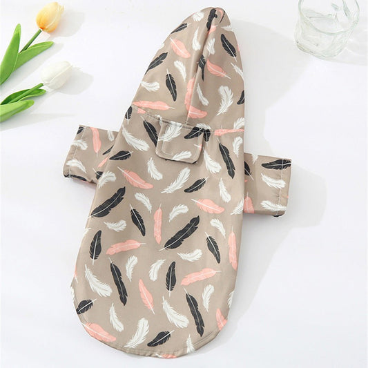 Pet Panache Boutique feather pattern pet raincoat showing colorful feather design and waterproof material for outdoor protection.