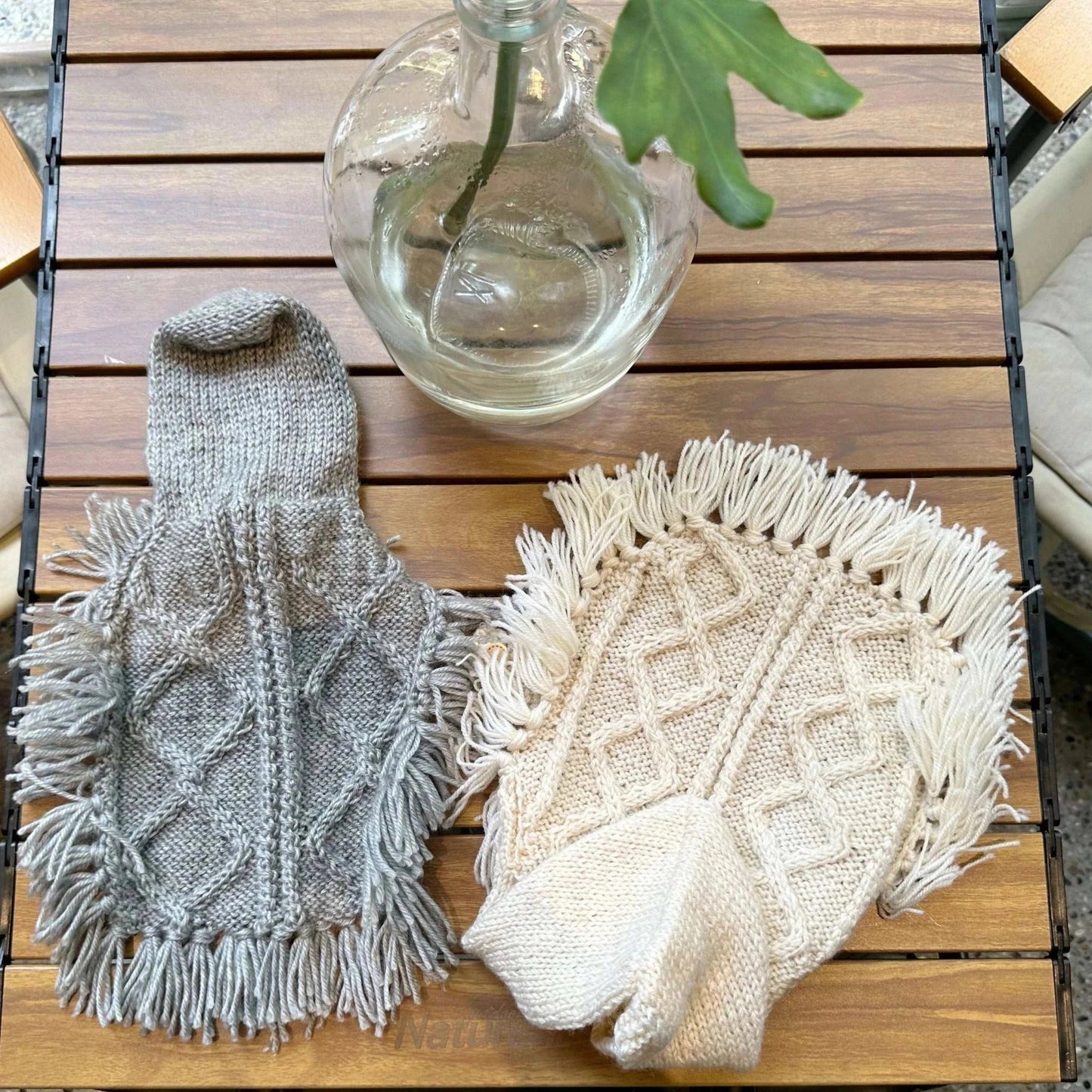 Pet Panache Boutique fringed knit sweater poncho with hoodie for pets, featuring cozy knit fabric and stylish fringe details.