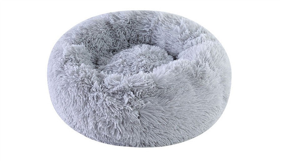 Gray plush round pet bed by Pet Panache Boutique with soft, cushioned fabric ideal for small to medium pets.