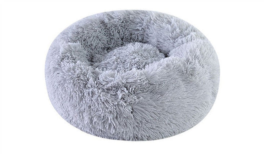 Gray plush round pet bed by Pet Panache Boutique with soft, cushioned fabric ideal for small to medium pets.