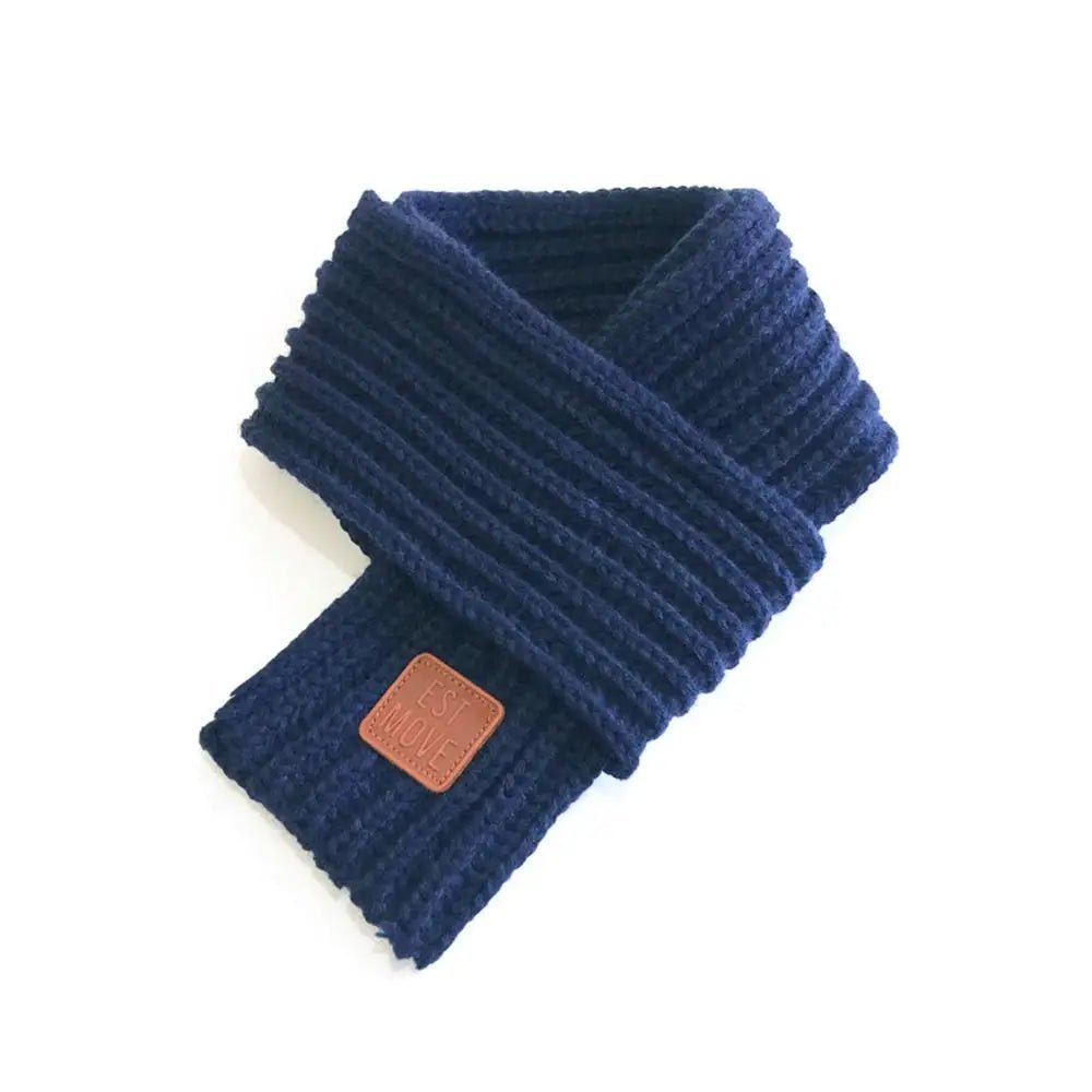 Navy knit pet scarf from Pet Panache Boutique, cozy and stylish accessory for dogs or cats, featuring soft knitted fabric.