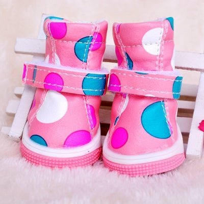 Pink polka dot pet boots from Pet Panache Boutique, stylish footwear with a cute pink and white polka dot pattern for pets.