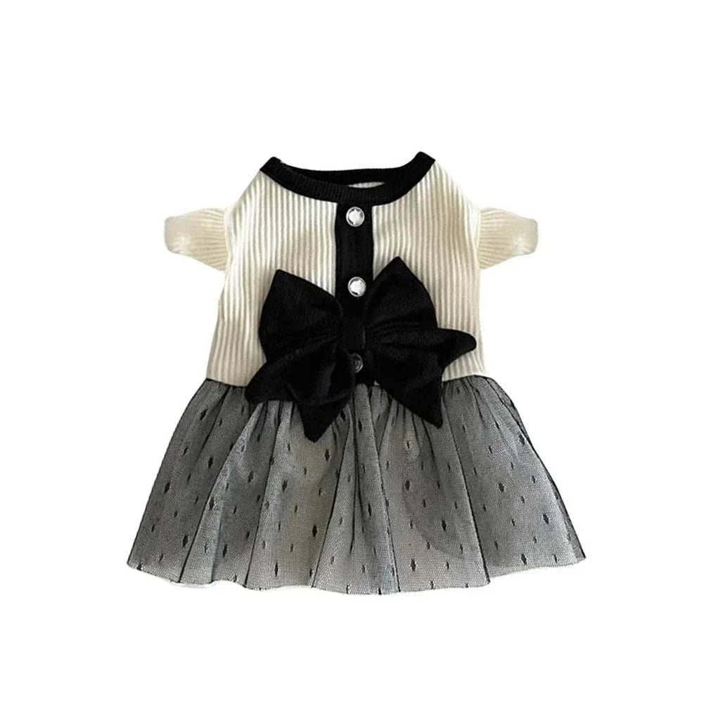 White pet dress with velvet bow and toule ruffle for dogs, by Pet Panache Boutique, featuring a stylish and elegant design.